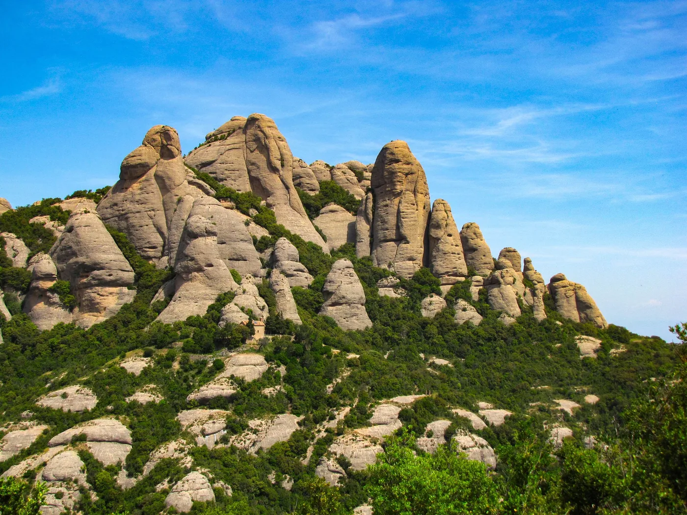 The serrated rock towers of the Montserrat massif above the Catalan plain
